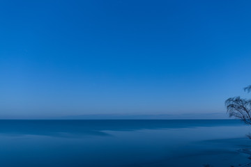 Obraz premium Calm Baltic sea in the morning. View from the sandy cliff