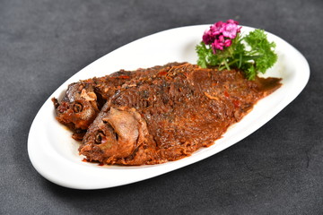 grilled beef steak with vegetables on white plate