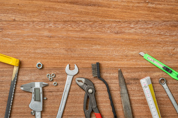 Tools on a wooden background with copy space