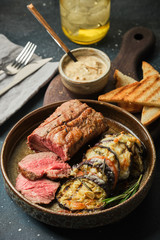 Veal tenderloin with vegetables, eggplants and tomatoes with demi-glace sauce.