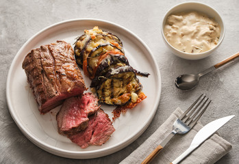 Veal tenderloin with vegetables, eggplants and tomatoes with demi-glace sauce.