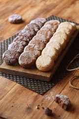 Three Chocolate Diamond Cookies, on wooden background.