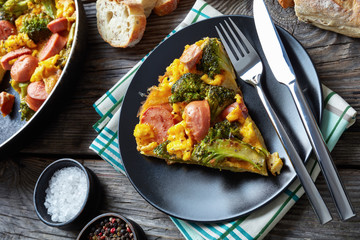 frittata with broccoli and sausages on a plate