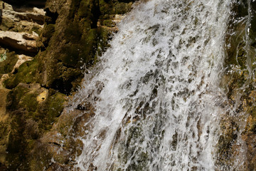 the river flows in the mountains in spring