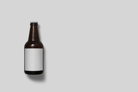 Beer Bottle Mock-Up isolated on soft gray background. Blank label.High resolution photo.