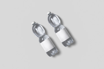 Plastic Bottles of pure Water with Blank Tag on soft gray background. 3D rendering. Realistic Mock up.