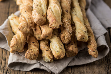 Snack of Grissini Bread Sticks on a Wooden Background Tapas Bar Homemade Bread Sticks Close Up Horizontal Photo