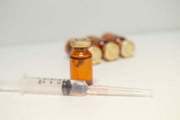 Medicine bottle and syringe