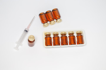 Medicine bottle and syringe