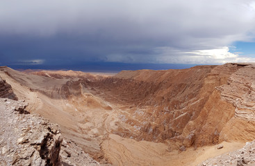Fototapeta na wymiar View of the landscape of rocks of the Mars Valley (Valle de Marte) and Cordillera de la Sal, Atacama Desert, Chile