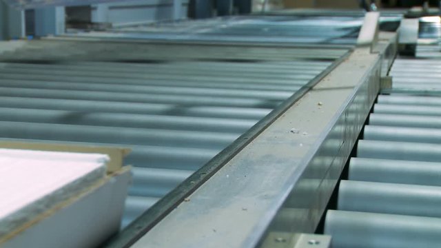 Industrial line for packing goods in cardboard boxes, counting and controlling this process