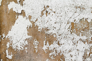 Old paint on the concrete wall texture background.