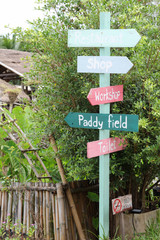 Colorful wooden sign in the garden.