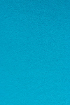 colored paper as fashion texture background in bright blue tone