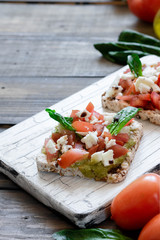 Caprese salad with pesto and balsamic vinegar on multigrain bread
