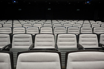 Fototapeta premium Empty grey seats in theatre or conference