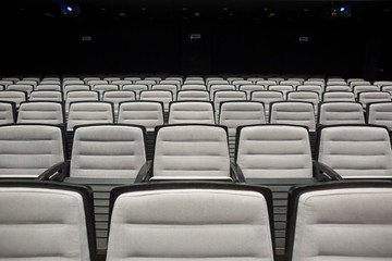 Empty grey seats in theatre or conference