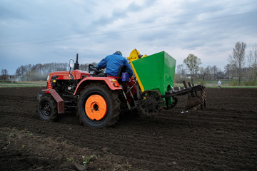 Fototapeta premium work of the tractor in the field