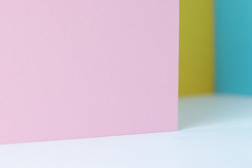 colored paper as fashion texture background in pastel color tone with shadow
