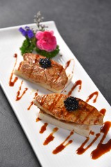 grilled salmon steak with sauce and vegetables