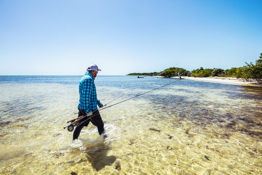 Walking the beach looking for bonefish