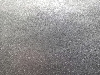 Silver foil shiny metallic texture background wrapping paper for holiday wallpaper decoration element. Abstract silver background with copy space