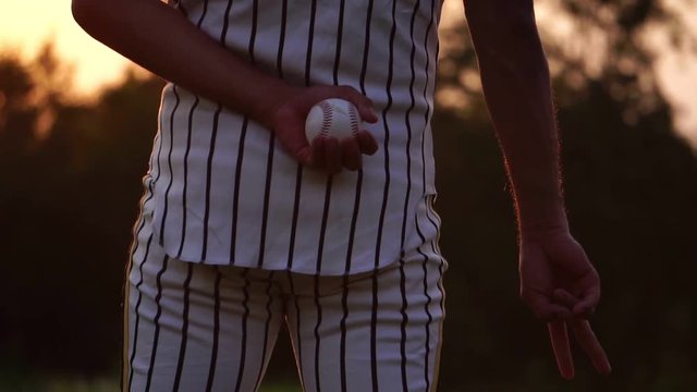 Baseball Men Are Hand Signals To His Teammates Before Throwing A Baseball Footage Slow Motion