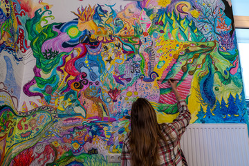 Artist woman painting wall, psychedelic  artwork mystic, fantasy imagination 