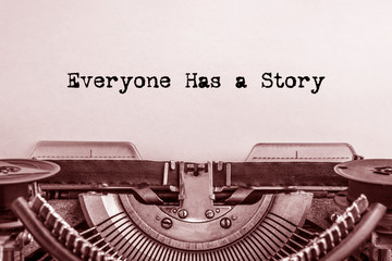 Everyone has a Story printed on a sheet of paper on a vintage typewriter. writer, journalist.
