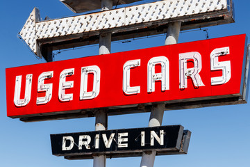 Used Car Drive In neon sign from the 50s at a pre owned car dealership I