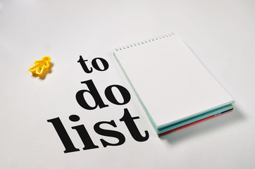 to do list text on notepad with office accessories