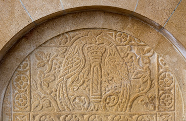 Old bas-relief on stone source (Peloponnesus, Greece).