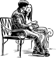 A couple of young townspeople sitting on a park bench