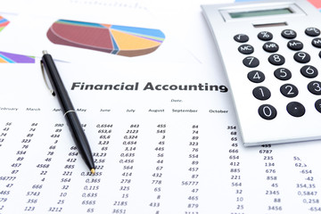 calculator and stationery items on the table, Financial accounting.