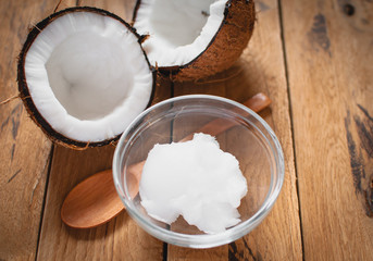 Close-up of coconut oil on wooden board 