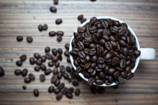 Coffee beans in coffee cup.