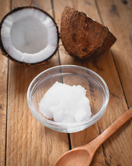 Close-up of coconut oil on wooden board 