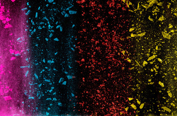 Abstract falling colored powder isolated on black