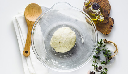 banner of pasta dough in a glass bowl on the table. home cooking food. healthy food