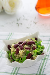 Kinoa salad with mexican beans on white background