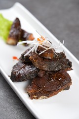 grilled steak with sauce and vegetables