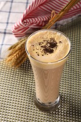 cup of coffee with cream on white background