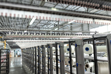 Fototapeta premium Carpet factory, carpet production, synthetic yarns for weaving looms