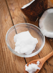 Close-up of coconut oil on wooden board 