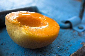 Fresh apricot slice on blue background, healthy food, fresh apricot