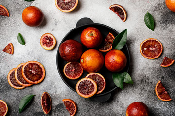 Fresh ripe red oranges on dark background. Healthy orange fruits background many orange fruits. 