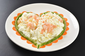 fried egg with bacon and vegetables on white plate