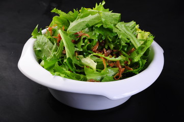 fresh salad in a bowl isolated on white