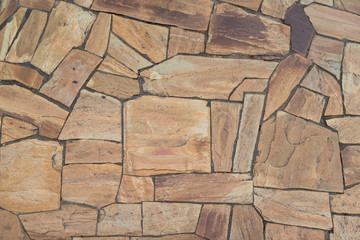 Background from natural stone slabs of various shapes on top