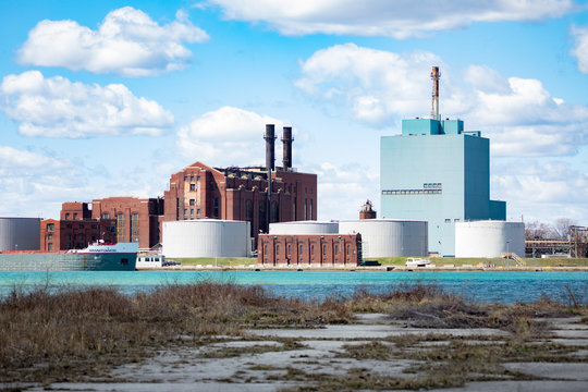 Detroit Michigan Skyline Industrial Buildings Litter Landscape with Moored Vessel